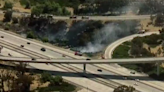 Firefighters battle vegetation fire near I-805, SR-905