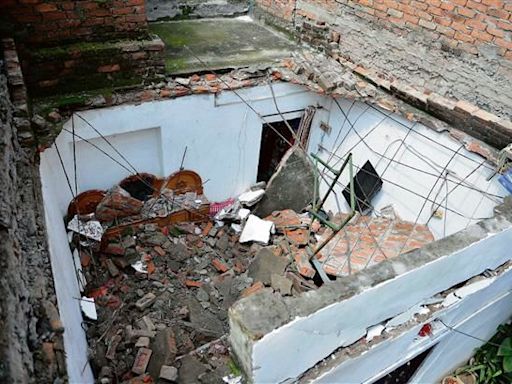 Miraculous escape for elderly woman as roof gives way