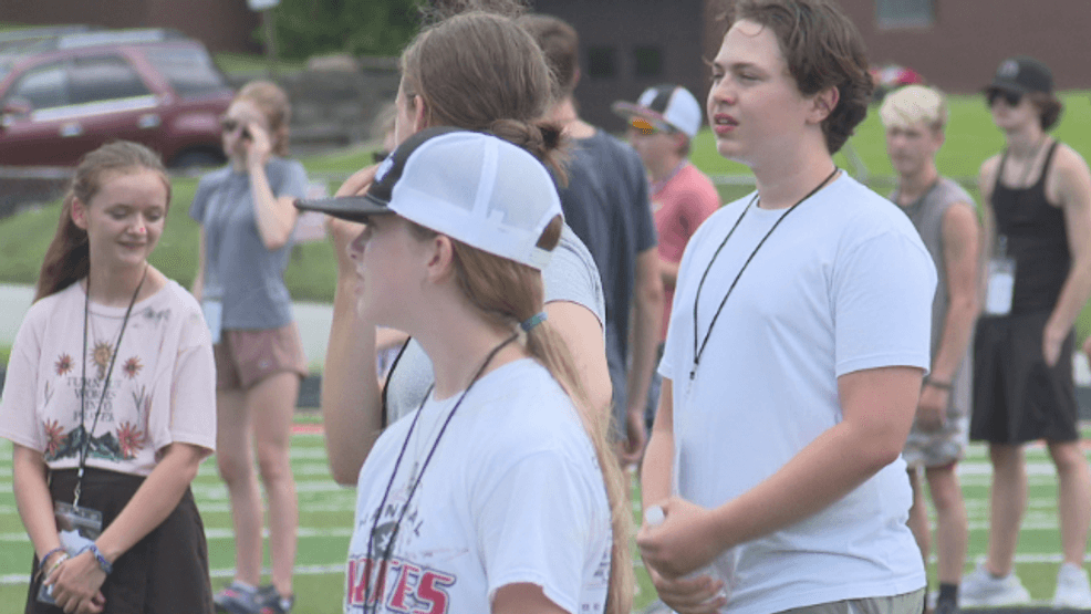 Hannibal High School band perseveres through "swampy" outdoor conditions