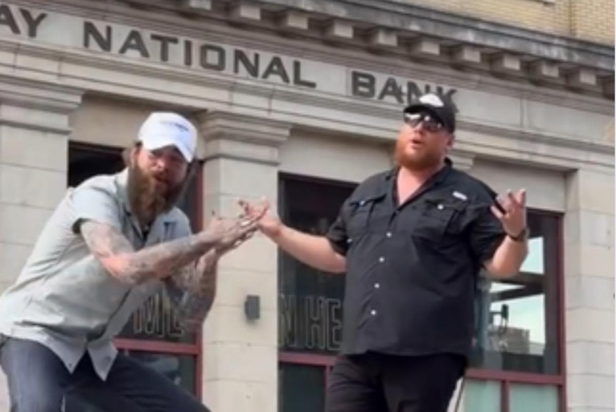 WATCH: Luke Combs + Post Malone Perform on a Moving Truck in Downtown Nashville