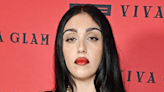 Madonna’s Daughter Lourdes Strikes a Pose in Form-Fitting Leopard Print Dress and Bold Red Lip at Event