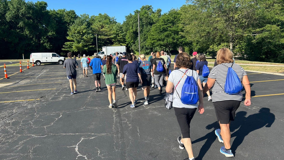 Community members walk and run together to support cancer survivors