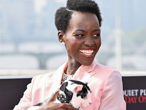 Why Did Lupita Nyong’o Accessorize Her Bubblegum Suit With a Live Cat?