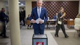 Lithuanians return to the polls with incumbent president favored to win 2nd election round