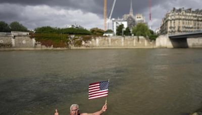 An American swims in Paris’ Seine River before the Olympics despite contamination concerns