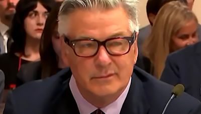 Alec Baldwin scowls as he's blasted for 'playing pretend with real gun' at trial