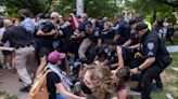 Photos: Dozens of ‘Gaza solidarity’ protesters detained at UNC tent encampment; battle for US flag on campus