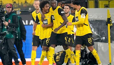 Football: Borussia Dortmund thump Bochum; AC Milan beat Lecce to go level with Serie A leaders Torino