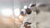 Fan Catches Ye Sleeping in a Bathrobe on a Plane