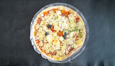 Forget Pizza Cutters. Break Frozen Pies Apart Right In The Plastic Instead