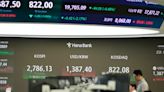 Stock market today: Asian stocks fall after a torrent of profit reports leaves Wall Street mixed