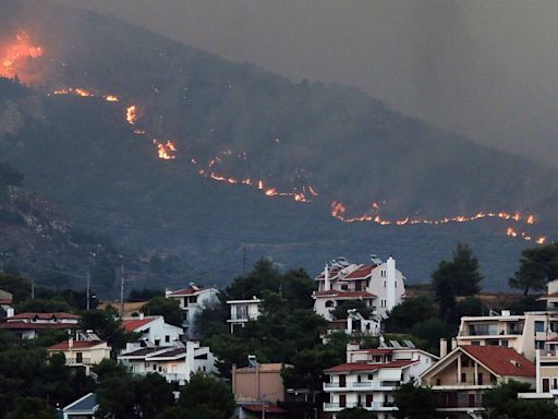 Greece wildfires - latest: Evacuations ordered on edge of Athens as burning pin cones spread flames