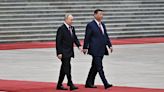 Xi vows to 'cherish and nurture' China-Russia ties as Putin arrives in Beijing