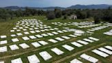 A neglected burial ground for migrants on Greek island of Lesbos has been given a drastic overhaul