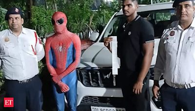 Delhi Police Arrest 'Spider Man' found riding on car bonnet in Dwarka - The Economic Times