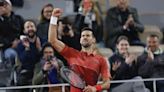 Djokovic keeps French Open title defense going by getting past Musetti in 5 sets