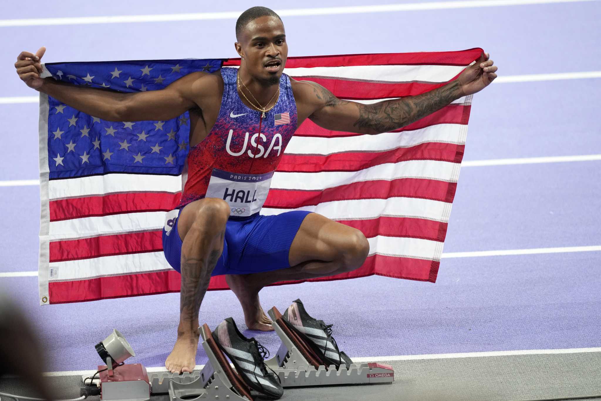 Latest US track comeback puts Quincy Hall atop the medal stand in Olympic 400 meters