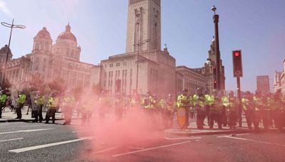 Liverpool riots: First group of people involved in riots appear in court - with one swearing as he was taken away