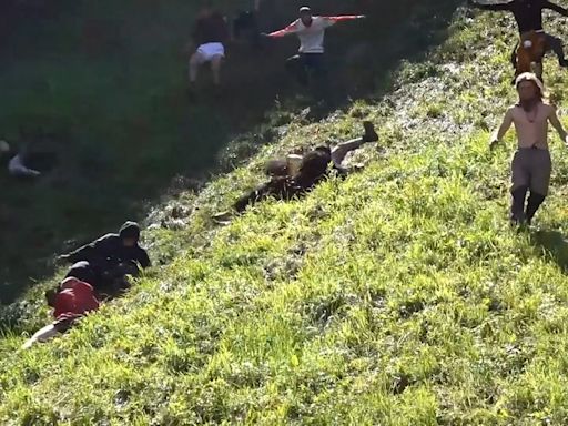 Watch: Daredevils tumble down Cooper’s Hill for annual Gloucester cheese rolling race