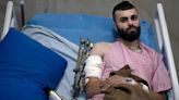 A Palestinian was shot, beaten and tied to an Israeli army jeep. The army says he posed no threat