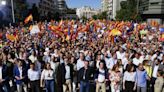 Hundreds of thousands protest Spain's prime minister swearing-in and Catalan deal