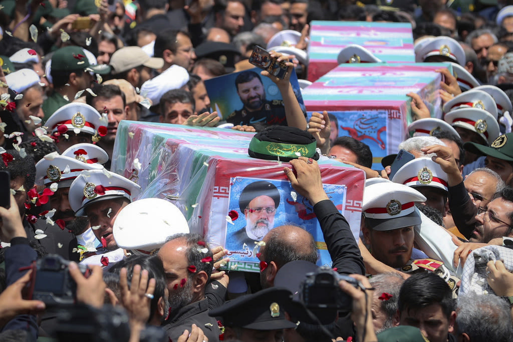 Iran begins burying president, foreign minister and others killed in helicopter crash