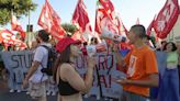 Extinction Rebellion protesters chain themselves up outside G7 summit