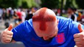 Barber who shaved St George cross into his hair among fans in Berlin