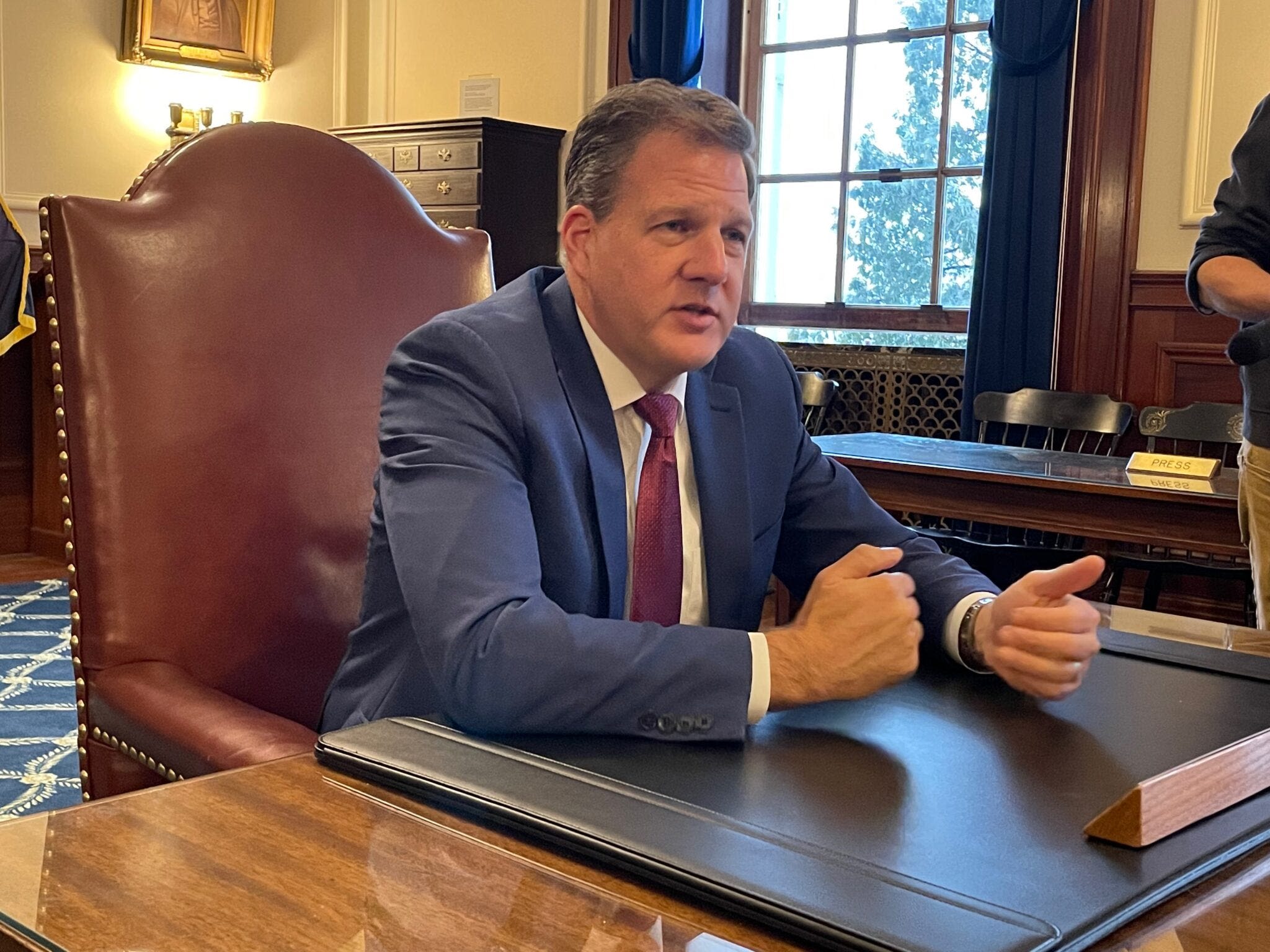 Sununu signs strict NH voter ID law, takes effect after 2024 election