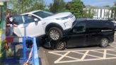 Land Rover crushes front of another car after driver lost control in car park
