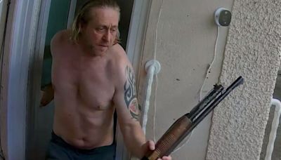 Moment shirtless man charges at neighbour with shotgun in loud music row