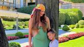 Pregnant Chrissy Teigen displays her growing baby bump on holiday