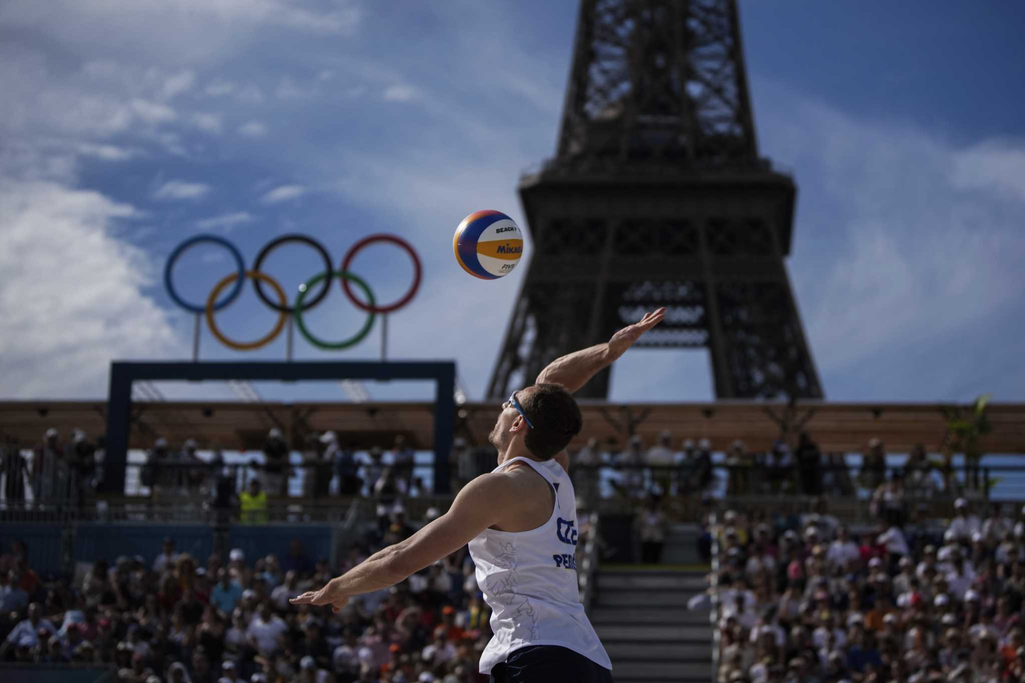 At the Olympic beach volleyball venue, the Eiffel Tower stars in a très French show