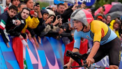 Cycling: Evenepoel recovers from big night out to win TT gold