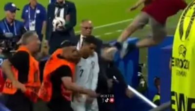 Cristiano Ronaldo narrowly avoids being two-footed in the face by fan