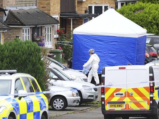 U.K. police search for man armed with crossbow after 3 women killed in home near London