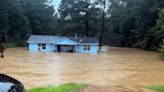 People rescued from cars and homes as torrential rain causes flash flooding in central Mississippi