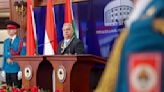 Hungary's Prime Minister Viktor Orban receives a medal from pro-Russia Bosnian Serb president Dodik