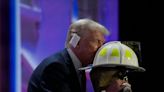 Trump kisses fire suit of fallen rally goer Corey Comperatore on RNC stage