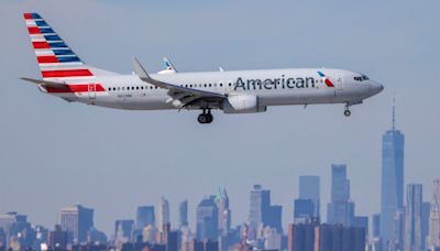 American Airlines passengers forced to intervene when man becomes violent towards a woman in first class