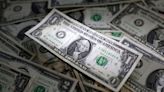 US dollar falls, but off four-week lows, as Fed signals more rate hikes