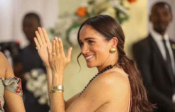 Meghan Markle Opted for a Pale Pink Maxi Dress on Day 1 of Her Trip to Nigeria