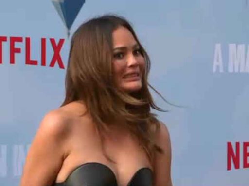 Chrissy Teigen Reacts to Near-Wardrobe Malfunction on Red Carpet, Shows 'Anxiety Hives'