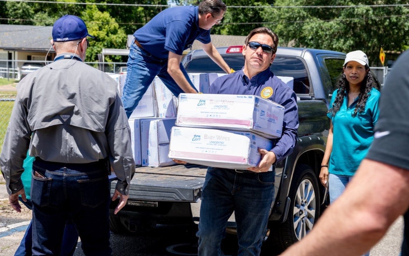 Florida Gov. DeSantis visits Tallahassee school to help distribute supplies after storm