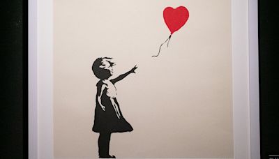 Two men charged with burglary after Banksy painting stolen