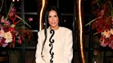 We're so obsessed with Demi Moore rocking white knee-high boots and a striking monochrome co-ord