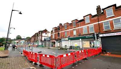 Fire-hit building to be bulldozed as 100-day wait for road to reopen continues