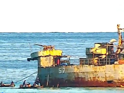 中菲仁愛礁爭端 菲律賓「坐灘」軍艦人員破壞中國漁民所放漁網