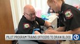 Connecticut police officers learning how to draw blood