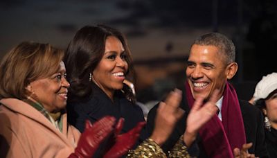 ... Barack Obama, right, shares a laugh with first lady Michelle Obama and his... Robinson, left, during the National Christmas Tree lighting ceremony in President's ...